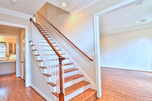 3628 Timberside Circle Dr, Houston, TX 77025 - stairway with wood finished floors, ornamental molding, baseboards, and recessed lighting