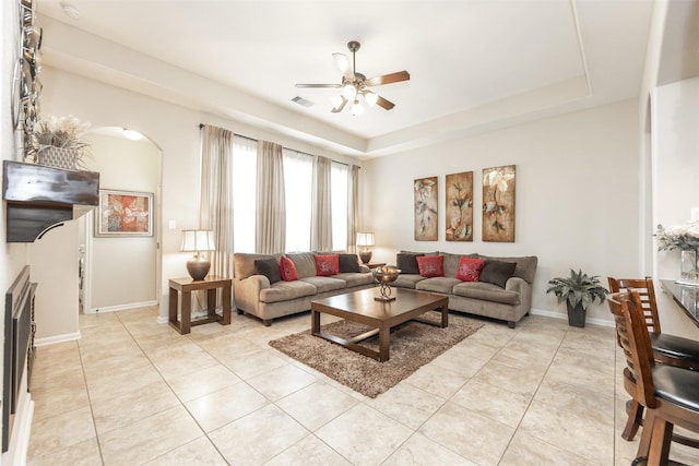 19315 S Cottonwood Green Ln, Cypress, TX 77433 - living area featuring ceiling fan, light tile patterned floors, baseboards, and a raised ceiling