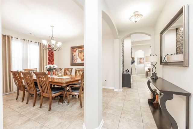 19315 S Cottonwood Green Ln, Cypress, TX 77433 - dining area featuring arched walkways, light tile patterned floors, a chandelier, and baseboards