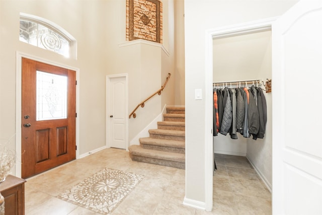 19315 S Cottonwood Green Ln, Cypress, TX 77433 - foyer entrance featuring stairway, baseboards, and light tile patterned floors