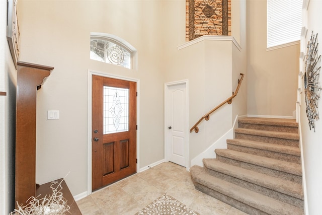 19315 S Cottonwood Green Ln, Cypress, TX 77433 - foyer entrance featuring a towering ceiling, stairs, baseboards, and light tile patterned floors