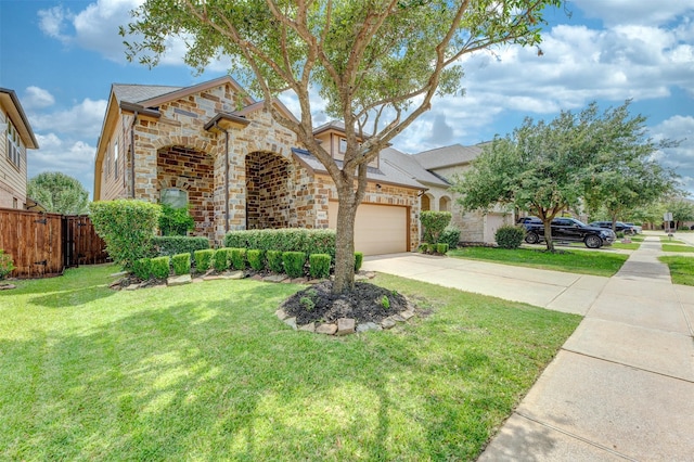 19315 S Cottonwood Green Ln, Cypress, TX 77433 - view of front of home with stone siding, concrete driveway, and an attached garage