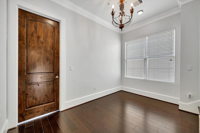 2010 Sabine St, Houston, TX 77007 - entrance foyer featuring a chandelier, baseboards, crown molding, and dark wood-style flooring