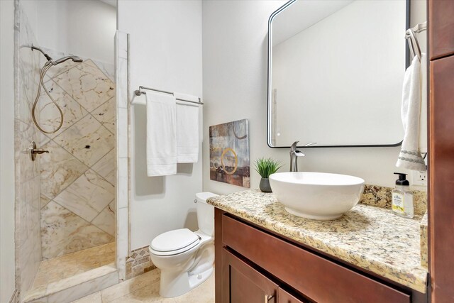 2010 Sabine St, Houston, TX 77007 - bathroom featuring a tile shower, vanity, and toilet