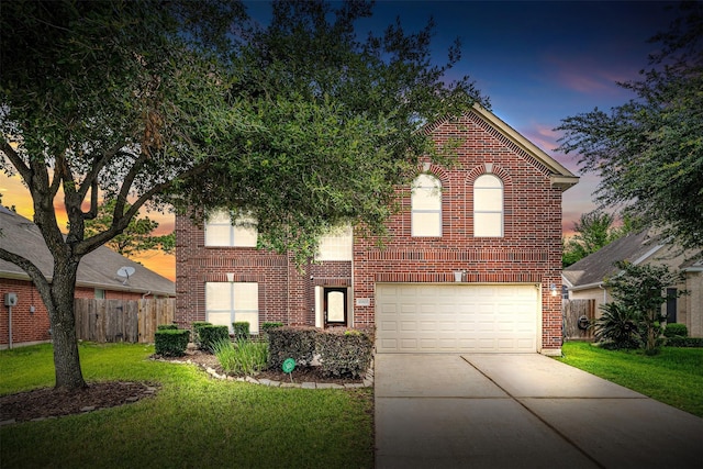 traditional-style home with concrete driveway, brick siding, and a garage