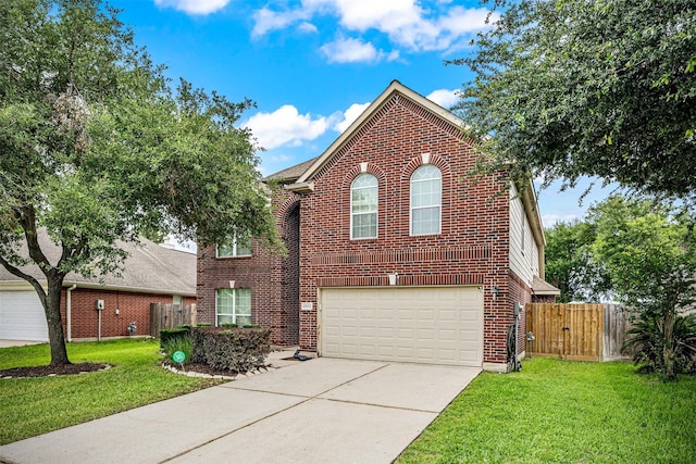 traditional home featuring brick siding, driveway, an attached garage, and a gate