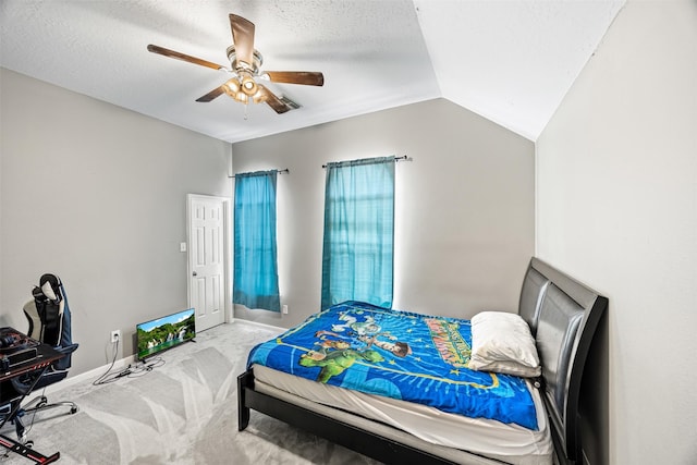 bedroom with lofted ceiling, carpet floors, a ceiling fan, baseboards, and a textured ceiling