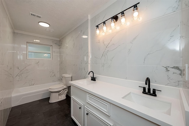bathroom with tile walls, toilet, a textured ceiling, double vanity, and bathtub / shower combination