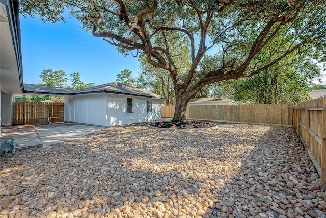fenced backyard featuring a patio area