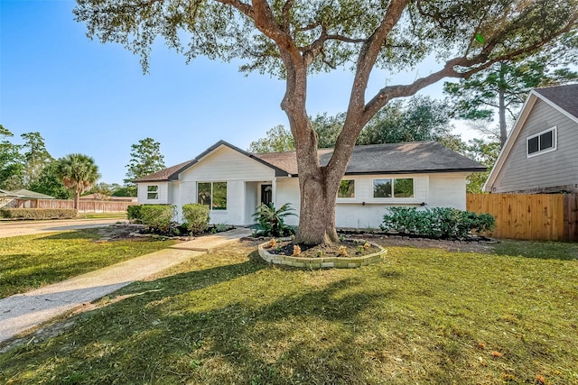 ranch-style home featuring roof with shingles