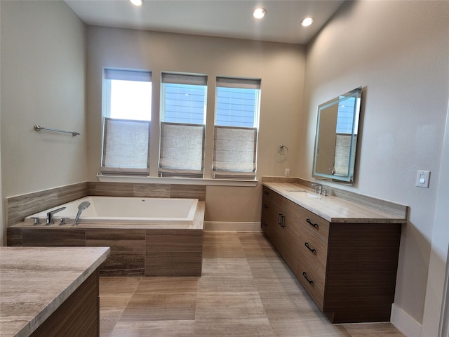 3308 Cardinal Crest Ln, Houston, TX 77080 - bathroom with vanity, a garden tub, baseboards, and recessed lighting