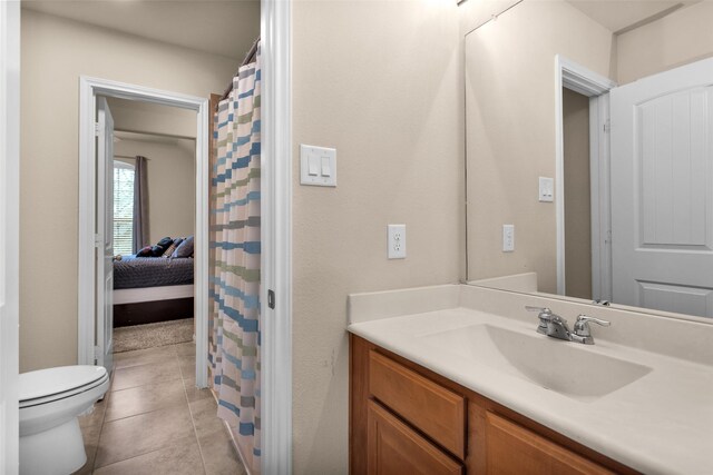 13607 Summer Hill Dr, Montgomery, TX 77356 - bathroom featuring toilet, vanity, tile patterned floors, and a shower with curtain