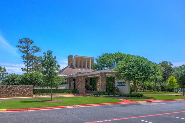 13607 Summer Hill Dr, Montgomery, TX 77356 - view of front of home featuring a front lawn and a chimney