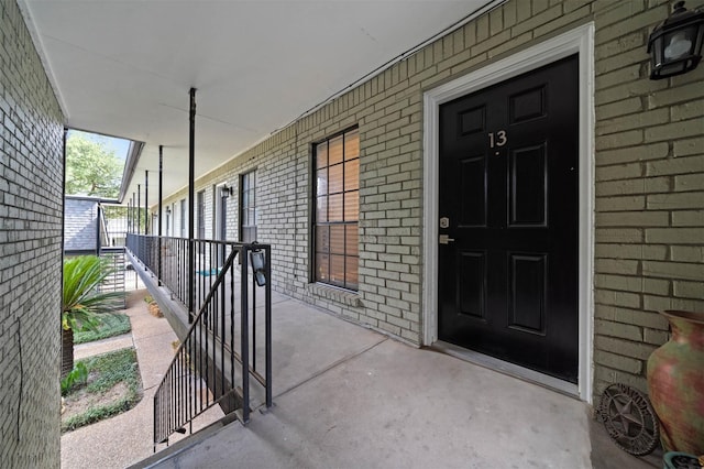 3402 Garrott St Unit 13, Houston, TX 77006 - property entrance with covered porch and brick siding