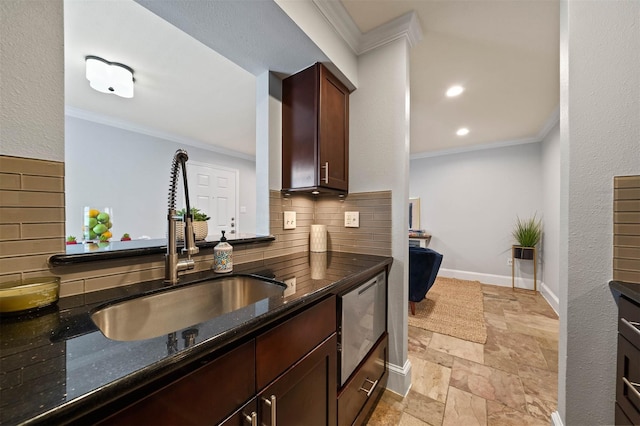 3402 Garrott St Unit 13, Houston, TX 77006 - kitchen featuring stone tile flooring, a sink, decorative backsplash, dark stone countertops, and ornamental molding