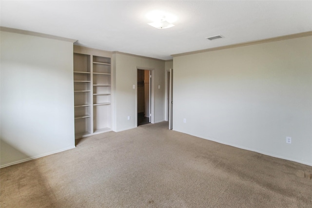 unfurnished bedroom featuring ornamental molding and carpet flooring