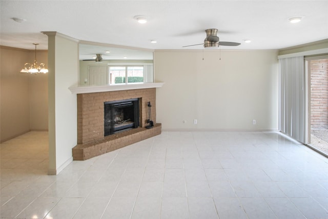 unfurnished living room featuring ceiling fan, a brick fireplace, a chandelier, baseboards, and recessed lighting