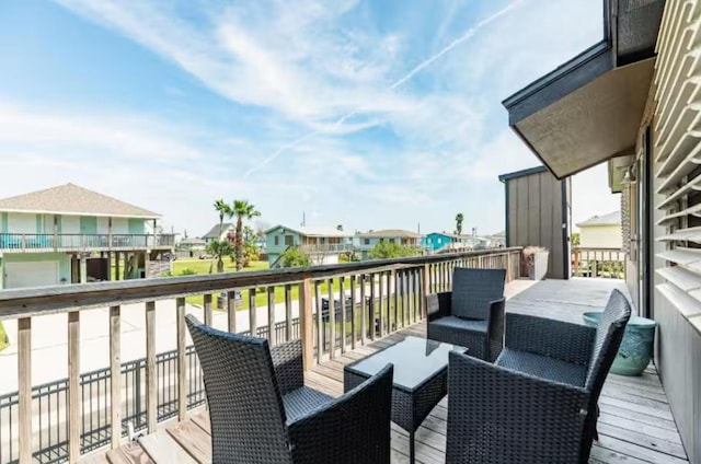 16631 Henry Morgan Rd, Jamaica Beach, TX 77554 - wooden terrace featuring a residential view and an outdoor living space
