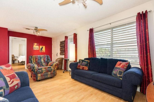16631 Henry Morgan Rd, Jamaica Beach, TX 77554 - living room featuring a ceiling fan and wood finished floors