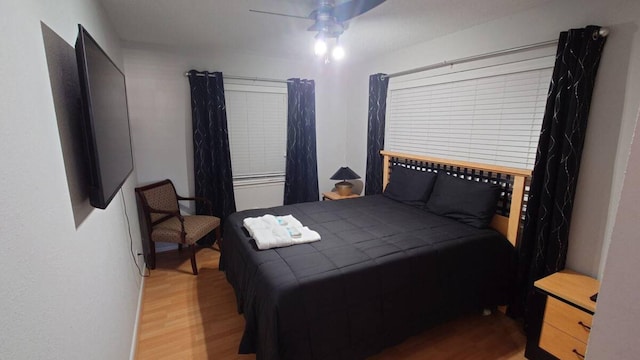 16631 Henry Morgan Rd, Jamaica Beach, TX 77554 - bedroom with wood finished floors and a ceiling fan