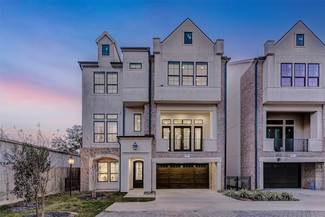 2120 Blalock Rd Unit D, Houston, TX 77080 - view of front of house with a garage, fence, and stucco siding