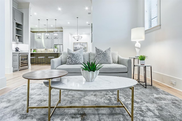 2120 Blalock Rd Unit D, Houston, TX 77080 - living room featuring beverage cooler, bar area, light wood finished floors, recessed lighting, and baseboards