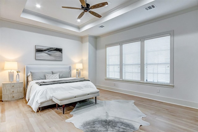 2120 Blalock Rd Unit D, Houston, TX 77080 - bedroom featuring wood finished floors, a tray ceiling, baseboards, a ceiling fan, and recessed lighting