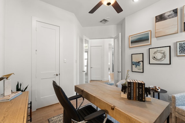 12027 Crooked Creek Ln, Santa Fe, TX 77510 - home office with ceiling fan and light wood-type flooring