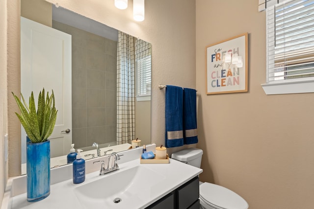 12027 Crooked Creek Ln, Santa Fe, TX 77510 - bathroom with toilet, vanity, and a textured wall