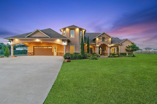9436 Hufsmith Rd, Tomball, TX 77375 - view of front facade featuring stone siding, stucco siding, concrete driveway, and a garage