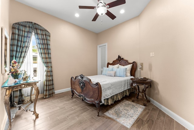 9436 Hufsmith Rd, Tomball, TX 77375 - bedroom featuring wood finished floors, baseboards, recessed lighting, and a ceiling fan