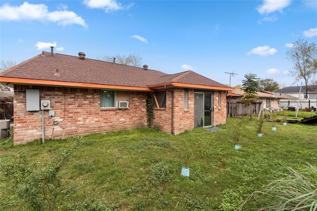 1927 Dormstom Ln, Houston, TX 77088 - back of property featuring brick siding, roof with shingles, and cooling unit