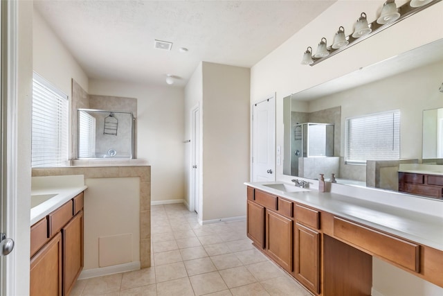 13602 Kodiak Brown Bear St, Crosby, TX 77532 - full bathroom with a stall shower, tile patterned floors, and two vanities