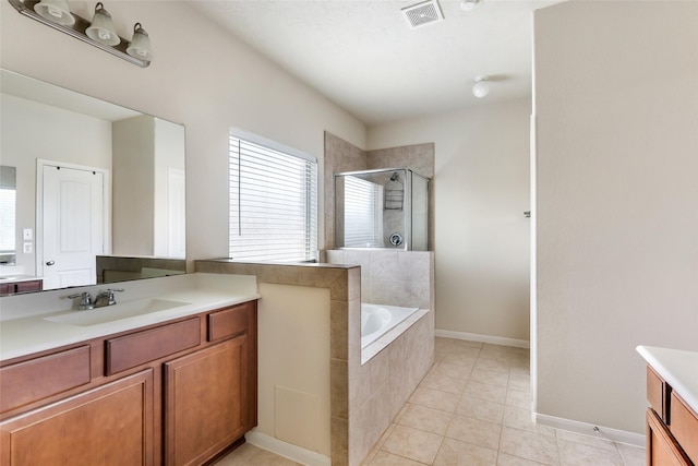 13602 Kodiak Brown Bear St, Crosby, TX 77532 - bathroom with a shower stall, vanity, tile patterned floors, a garden tub, and baseboards