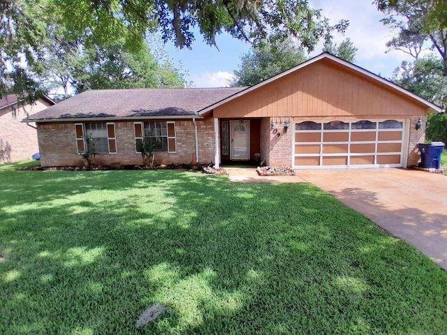 209 Montclaire Dr, West Columbia, TX 77486 - ranch-style house featuring an attached garage, a front lawn, concrete driveway, and roof with shingles