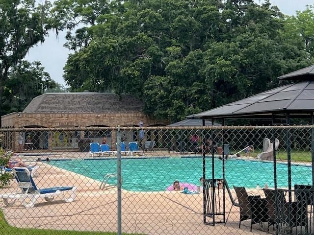 209 Montclaire Dr, West Columbia, TX 77486 - community pool featuring a water slide and a gazebo