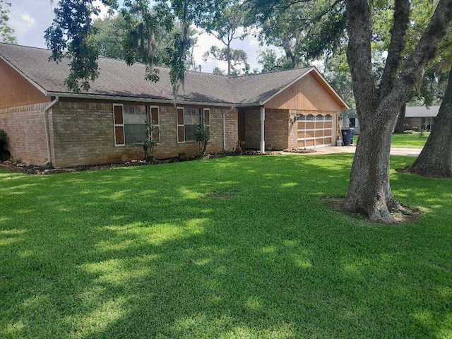 209 Montclaire Dr, West Columbia, TX 77486 - ranch-style house with brick siding, a garage, a front lawn, and a shingled roof