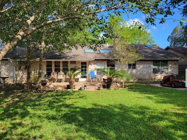 209 Montclaire Dr, West Columbia, TX 77486 - rear view of house with a patio area and a yard
