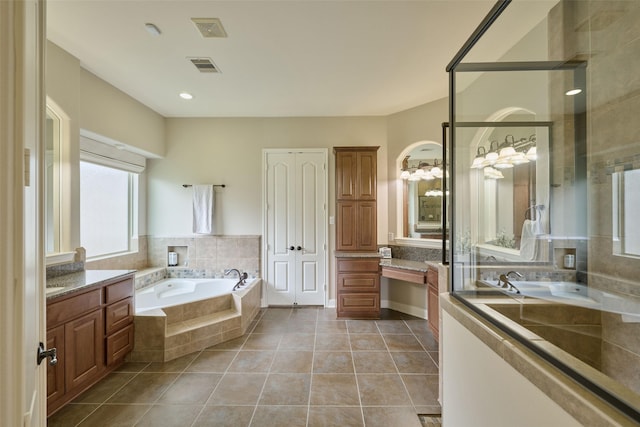13606 Oak Harbor Bnd, Cypress, TX 77429 - bathroom with tile patterned floors, vanity, and a bath