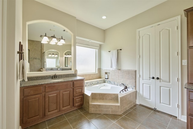 13606 Oak Harbor Bnd, Cypress, TX 77429 - full bath featuring vanity, a garden tub, and tile patterned flooring