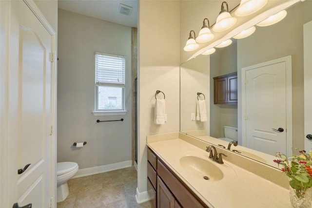 13606 Oak Harbor Bnd, Cypress, TX 77429 - bathroom with toilet, baseboards, vanity, and tile patterned flooring