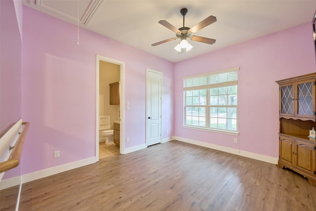 13606 Oak Harbor Bnd, Cypress, TX 77429 - unfurnished bedroom with attic access, wood finished floors, baseboards, and ensuite bathroom