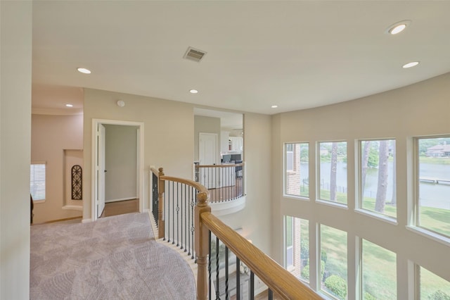 13606 Oak Harbor Bnd, Cypress, TX 77429 - hallway with an upstairs landing, plenty of natural light, recessed lighting, carpet flooring, and baseboards