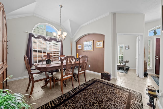 dining space featuring lofted ceiling, a chandelier, light tile patterned floors, and baseboards