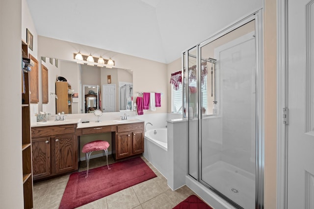 full bathroom with a stall shower, double vanity, a bath, tile patterned flooring, and vaulted ceiling