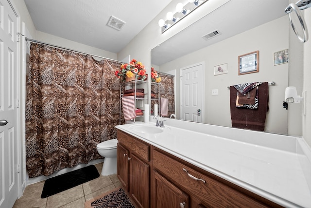 full bathroom with tile patterned flooring, toilet, vanity, and a shower with shower curtain