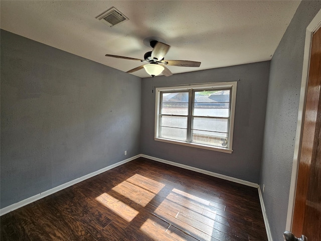 111 Carnation St, Lake Jackson, TX 77566 - empty room featuring dark wood-style floors, a ceiling fan, and baseboards