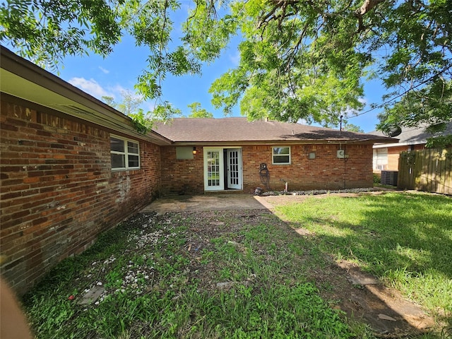 111 Carnation St, Lake Jackson, TX 77566 - rear view of property with brick siding, a patio area, and central AC