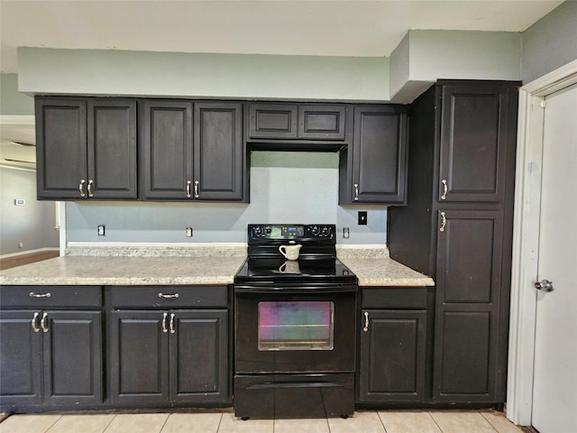 111 Carnation St, Lake Jackson, TX 77566 - kitchen featuring electric range, light countertops, and light tile patterned floors