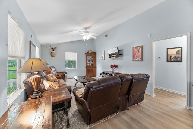 518 Marine Way, Freeport, TX 77541 - living room featuring light wood-style flooring, a ceiling fan, lofted ceiling, and baseboards